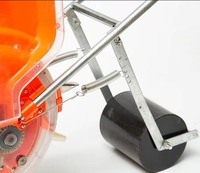 Semoir manuel portable à roulettes pour maïs avec réservoir à semences