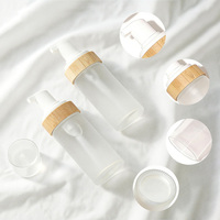 Flacon moussant professionnel pour nettoyant visage avec anneau en bambou, emballage en verre dépoli pour distributeur de mousse nettoyante pour le visage