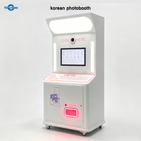 Cabina de fotos instantánea coreana YiXiLe con impresora expendedora para imprimir fotos.