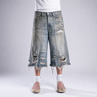 DiZNEW Short en jean déstructuré pour homme, style streetwear, extrêmement déchiré, à franges longues et ourlet brut, coupe ample
