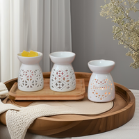 Ensemble de brûleurs d'huiles essentielles en céramique blanche de style nordique minimaliste avec motif étoilé ajouré, porte-bougie pour la décoration de la maison et le spa