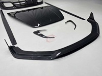 Kit carrosserie style OC en fibre de carbone sèche : Lame avant, sourcils de phares avant, jupes latérales, diffuseur arrière, capot pour Porsche Panamera 976