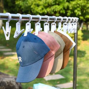 Clips multifonctionnels en plastique pour vêtements et chaussures, avec rotation à 360 degrés, options de couleurs blanc et noir - Product Image 1