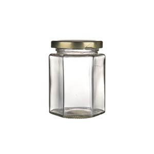 Bán Buôn Tùy Chỉnh Chất Lượng Cao Lục Giác Mật Ong MứT ThủY Tinh <span class=keywords><strong>Jar</strong></span> Gourmet Hex Chum Với Vít Tin Cap Cho Thực Phẩm - Product Image 1