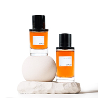 Flacon de parfum en verre transparent vide de luxe OEM en forme de cylindre de 50 ml et 100 ml avec bouchon magnétique