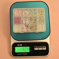 Ensemble d'accessoires pour ongles DIY en alliage, 12 grilles, avec strass en cristal rose, perles, fleurs, nœuds, cerises et papillons