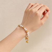 Bracelet élastique en perles de coquillages plaqué or en acier inoxydable style plage d'été DAIHE