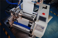 Machine d'étiquetage semi-automatique manuelle de haute qualité pour bouteilles rondes et sachets