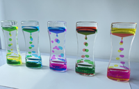 Nouveau liquide mouvement minuterie jouets sensoriels sablier liquide goutte à goutte minuterie jouets promotionnels calmer bouteille pour les enfants