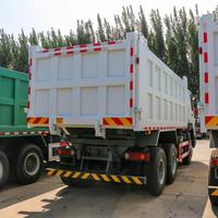 Camion benne HOWO d'occasion inspecté, 371 CV, 6x4, benne en U, basculement central, pour services d'enterrage de déchets