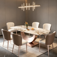 Table basse rectangulaire moderne et minimaliste, avec plateau en marbre et base en métal, idéale pour le salon.