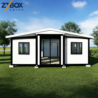ZYBOX Conteneur extensible en forme de L de 30 pieds et 40 pieds, maison extensible, cabane modulaire préfabriquée en grain de teck, retraite de glamping en plein air