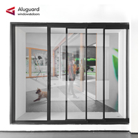 Porte coulissante en aluminium à rupture de pont thermique avec cadre fin et vue panoramique, à seuil bas pour salon |   Aluguard