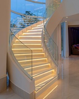 Escaliers incurvés LED de luxe avec marches en bois ou en marbre provenant de l'usine de Foshan