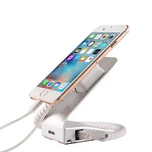 Anti theft phone stand with alarm and charging system