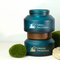 Pot en verre crème mat vert sarcelle à épaule oblique avec couvercle en bois massif pour emballage de soins de la peau en marque blanche OEM