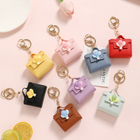 Vente Chaude Mini Porte-Monnaie en PU Couleur Bonbon avec Porte-clés et Décoration Ballon, Petit Charm de Sac pour Sac à Dos d'Enfants, Vente en Gros