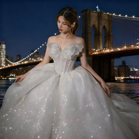 Robe de mariée royale de luxe, coupe oversize, col cœur, en tulle blanc scintillant, avec corset orné de perles brodées à la main