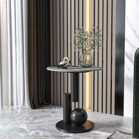Table d'angle de luxe nordique contemporaine et simple avec plateau rond en pierre frittée et base en acier inoxydable pour salon de villa et d'hôtel