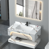 Meuble de salle de bain moderne en pierre frittée avec miroir LED et vasque en céramique