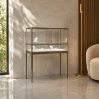 Vitrine d'îlot pour bijoux sur mesure, en verre trempé, avec éclairage LED et métal brossé, pour aménagements de magasins de détail