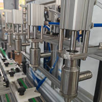 Machine de remplissage automatique à quatre têtes pour huile, détergent lessive et shampoing - Haute précision, compatible IoT, capacité 1-5L