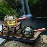 La théière en verre de Borosilicate de vente chaude avec le manche en bois peut 360 la bouilloire en verre tournante pour le thé
