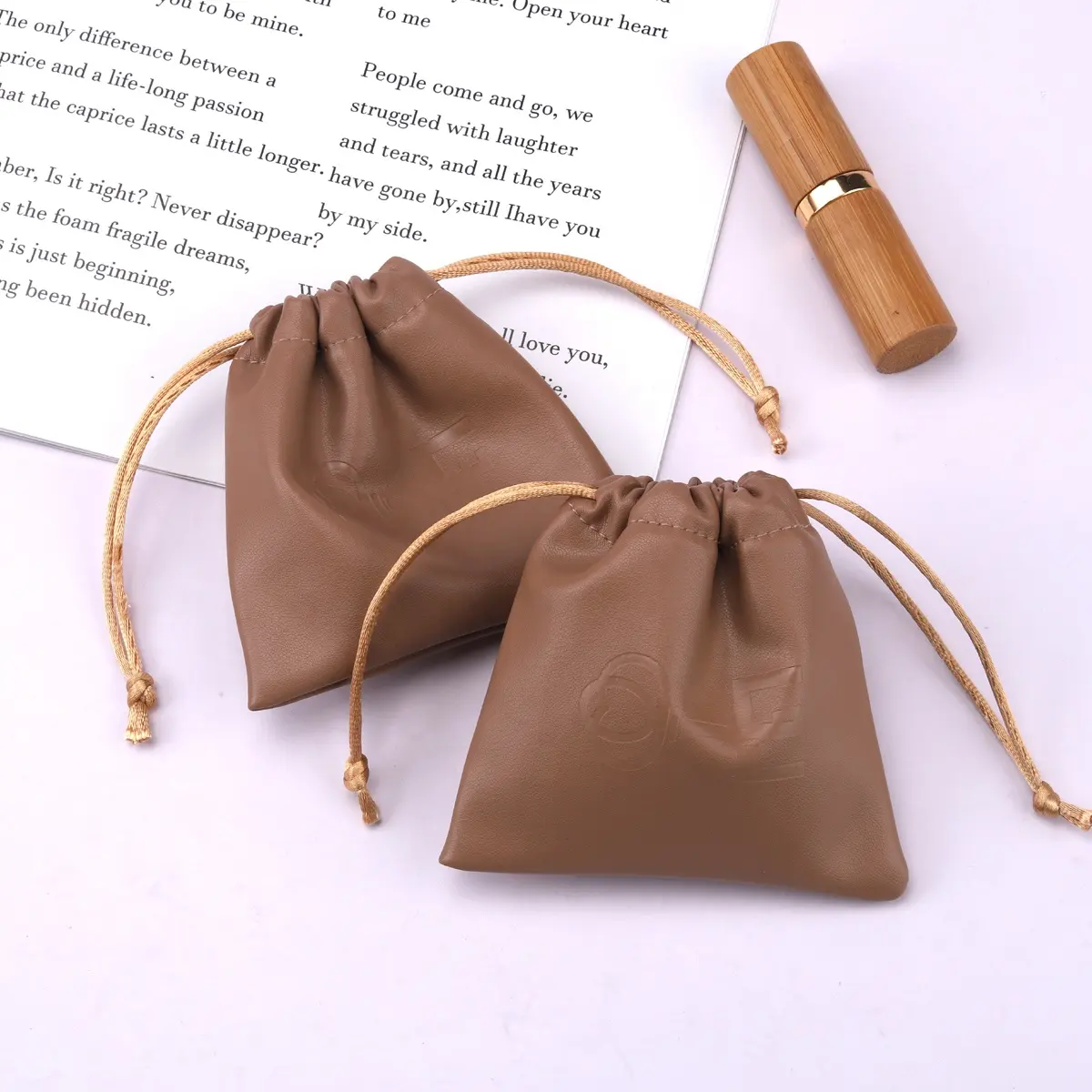 Custom Emboss Printed Small Leather Mobile Phone Charger Packing Bag Drawstring Waterproof Pu Leather Pouch