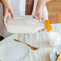 Bouteilles de lait en verre Offre Spéciale non toxiques de 32oz avec bec verseur Bouteilles de lait en verre réutilisables carrées transparentes pour jus