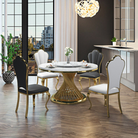 Ensemble de table à manger ronde de luxe moderne Meubles de maison élégants avec marbre artificiel en acier inoxydable pour le salon et l'hôtel