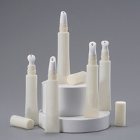 Tube en plastique personnalisé pour crème contour des yeux avec applicateur à bille massant et brosse multifonctionnelle