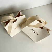 Sac en papier d'emballage cadeau de luxe personnalisé avec logo imprimé, respectueux de l'environnement, pour bijoux, cosmétiques, bougies, parfums, boutiques