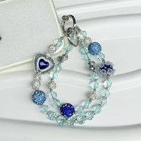 Nueva funda para teléfono con correa de pulsera de lentejuelas metálicas con efecto de diamante y cadena colgante