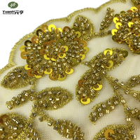 Dentelle florale dorée populaire avec broderie perlée et sequins pour robe de mariée de luxe sexy, 100 % polyester