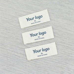 Etiquetas personalizadas de alta densidad para prendas de vestir, etiquetas de tafetán con acabado satinado y bordes plegados, finamente tejidas. - Product Image 1