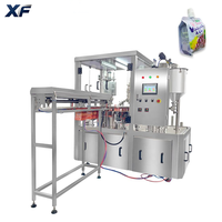 Machine de remplissage et de bouchage rotative XF entièrement automatique à double entraînement contrôlée par PLC pour sachets à bec verseur, remplisseuse de liquides et de pâtes Doypack