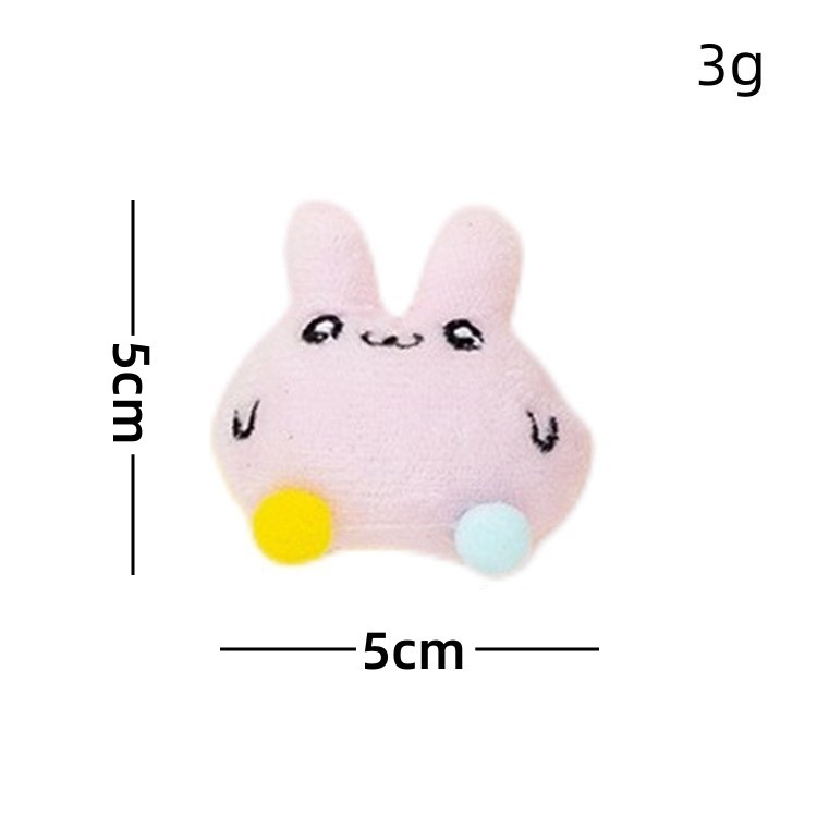 Muñeco de peluche de conejo rosa