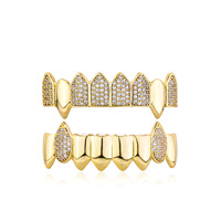 Vente en gros de bijoux dentaires en laiton style hip-hop, ensembles de grillz, bijoux corporels sertis de pierres, grillz tendance unisexe, crocs irréguliers, grillz, cadeaux en gros