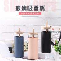 Gobelet en verre avec couvercle en bambou et paille, manchon en silicone résistant à la chaleur, tasse de voyage disponible en plusieurs couleurs, protection en silicone très vendue
