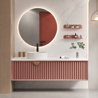 Meuble-lavabo flottant rose cannelé moderne avec vasque à poser, miroir LED rond et armoire murale pour projets hôteliers et d'appartements