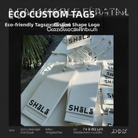 Étiquettes personnalisées pour vêtements en papier texturé, étiquettes de vêtements avec impression UV et estampage or pour l'emballage des vêtements