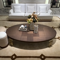 Table basse ovale en bois de style nordique moderne avec plateau en parquet et base en acier inoxydable pour salon
