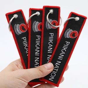 Porte-clés personnalisé avec symbole tribal, cadeau pour les passionnés de culture locale et de plein air, jet tag - Product Image 1