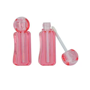 Jalea popular Tapa de forma irregular mini lindo plástico vacío embalaje de brillo de labios único tubo de envases de brillo de labios personalizado con cepillo