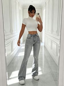 Pantalon en jean gris clair américain, délavé, élastique, légèrement évasé, coupe slim, long et large, qui rehausse la silhouette. - Product Image 5
