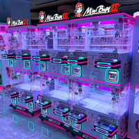 Machine de jeu d'arcade à monnayeur double couche pour 4 joueurs, avec accepteur de pièces, pour la distribution de peluches, idéale pour les centres commerciaux et les jeux parent-enfant.