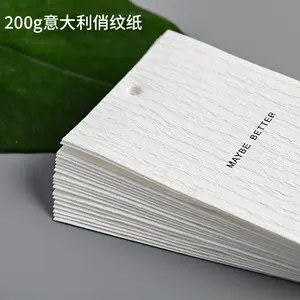 Kelas atas kustom 200g Qiao Wen kertas dalam tekstur hitam Foil Matte pakaian Hang tag