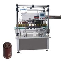 Machine de remplissage et de sertissage de capsules de vin en PVC dur, pour le remplissage et le rétrécissement de dosettes d'huile