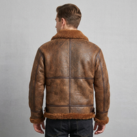 Blouson aviateur classique vintage pour homme en cuir véritable, peau de mouton, fourrure réversible, logo sur le devant, design tendance pour l'hiver