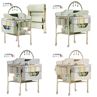 Table à langer et table de soin multifonctionnelle pour bébé, réglable en hauteur, pliable, avec fonction bain et roulettes